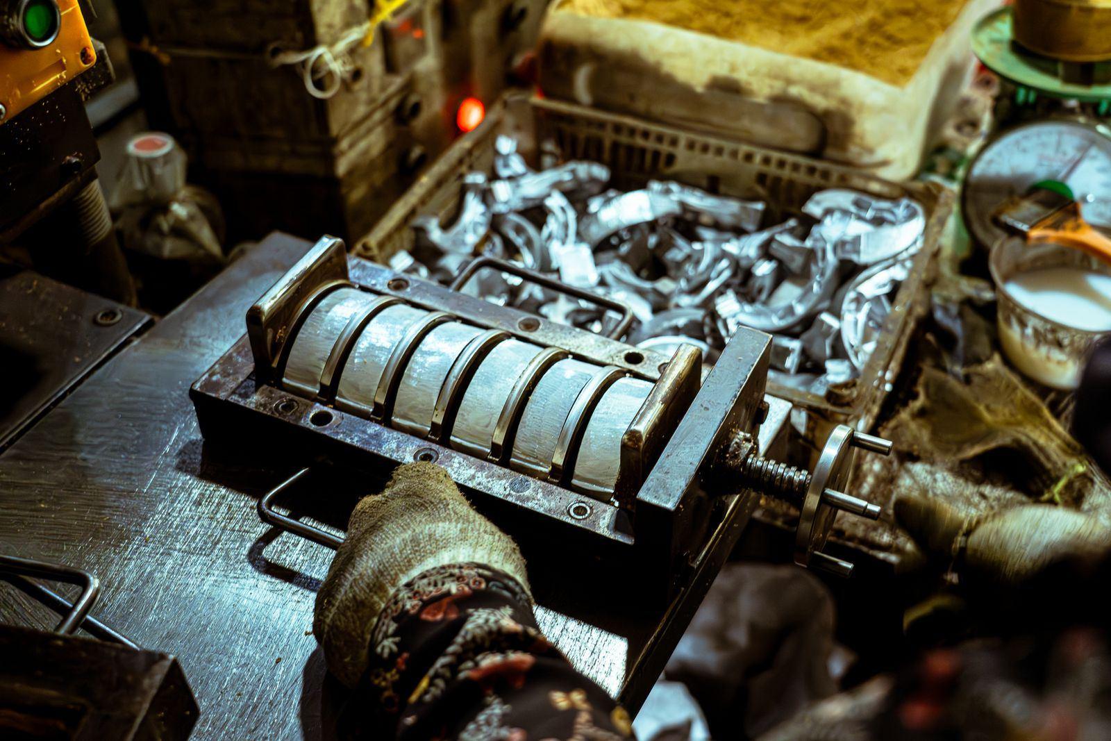 Representative photograph of pressed and formed metal pieces