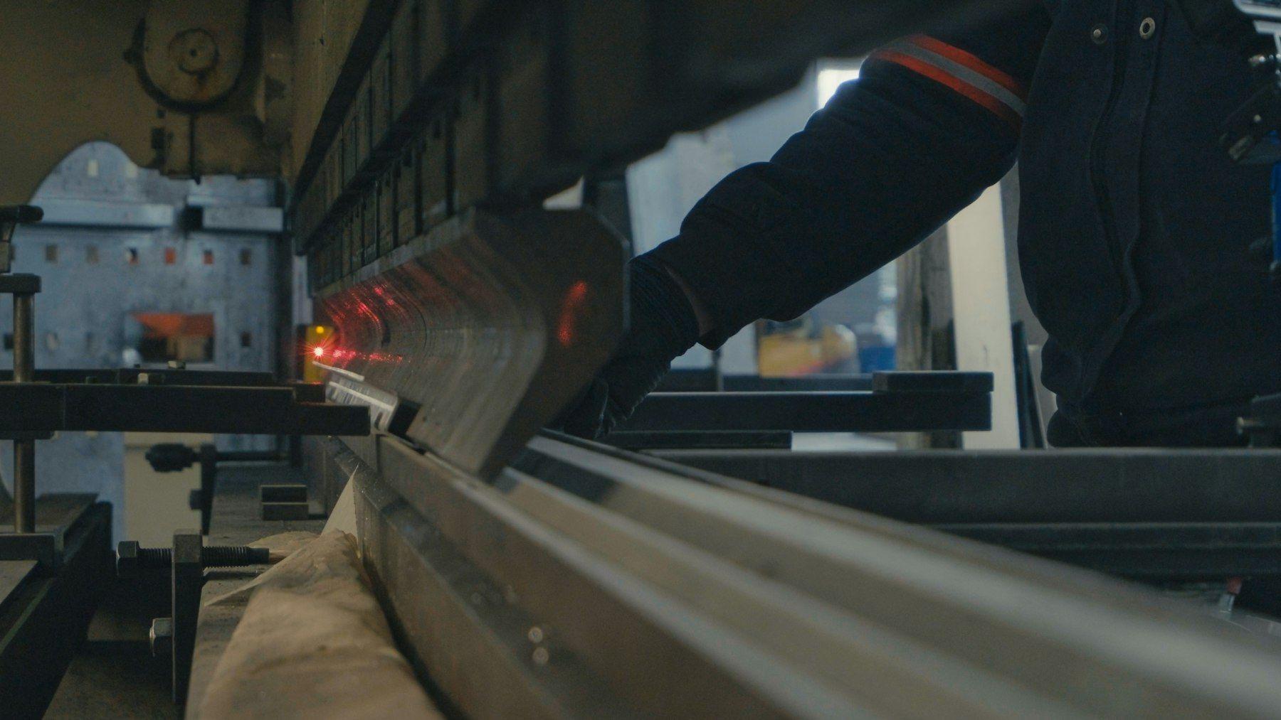 Representative photograph of a press brake forming a sheet metal angle