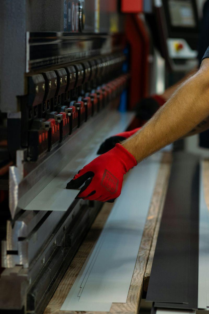 Representative photograph of sheet metal positioned in a press brake